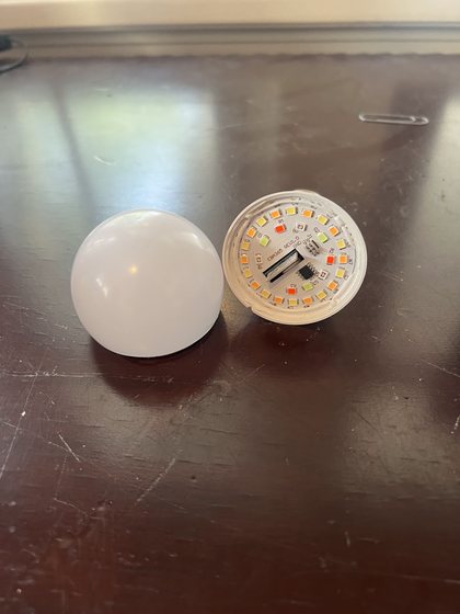 LED bulb opened to reveal its multi-channel emitter board